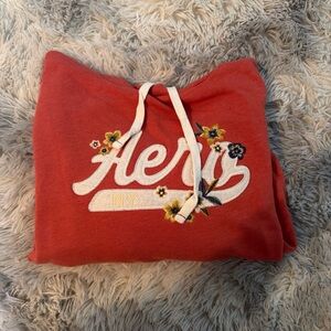 Aeropostale Coral Hoodie with White Drawstrings and Yellow Floral Accents